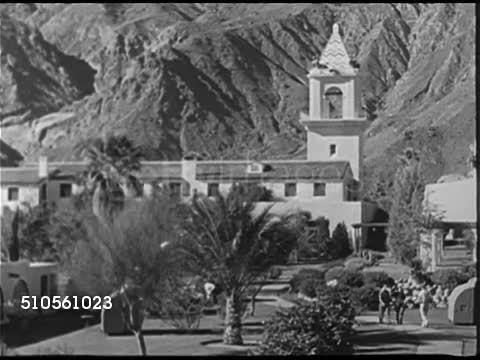 1945: CALIFORNIA MOUNTAINS: HA WS Snow skier skiing down slope. PALM SPRINGS: HA WS El Mirador Hotel & tower (burned 1989, rebuilt) people around pool, male diving high board. Male w/ two women (possibly owner P.T. Stevens), blonde poolside. Iconic.